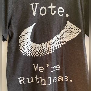 Vote! We’re Ruthless t shirt. Size large. Grey heather with white letters.